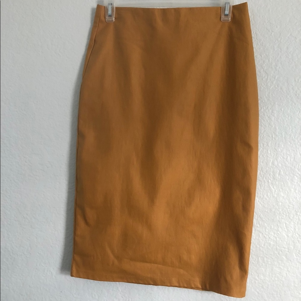 Brand new mustard leather like skirt . Medium .